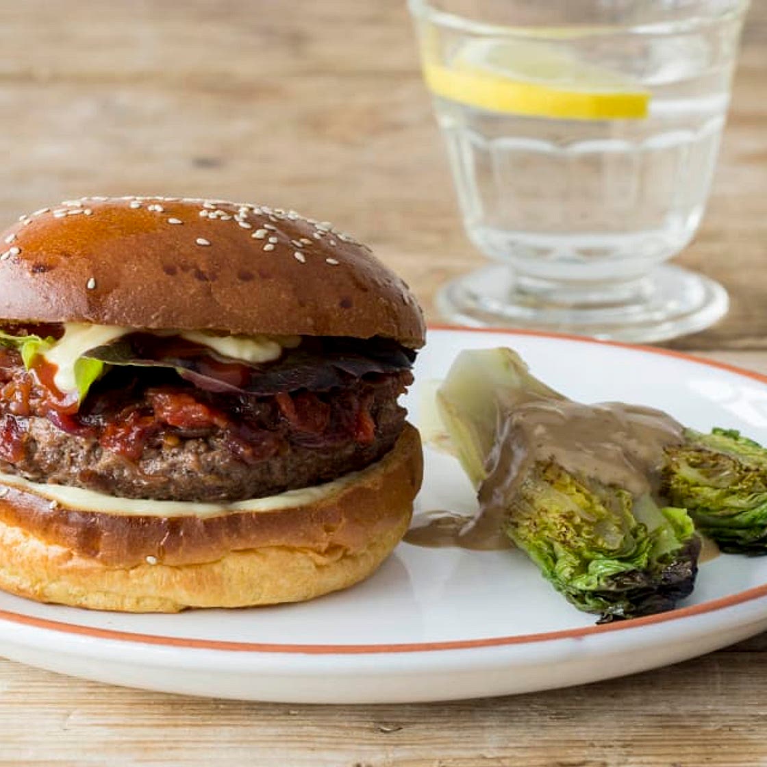 Juicy Lucy Burger with Tomato-Red Onion Jam and Charred Romaine