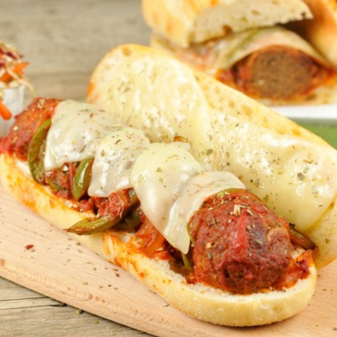 Zesty Gardein Vegetarian Meatball Sub With Melted Provolone, Sautéed Peppers, and Italian Slaw