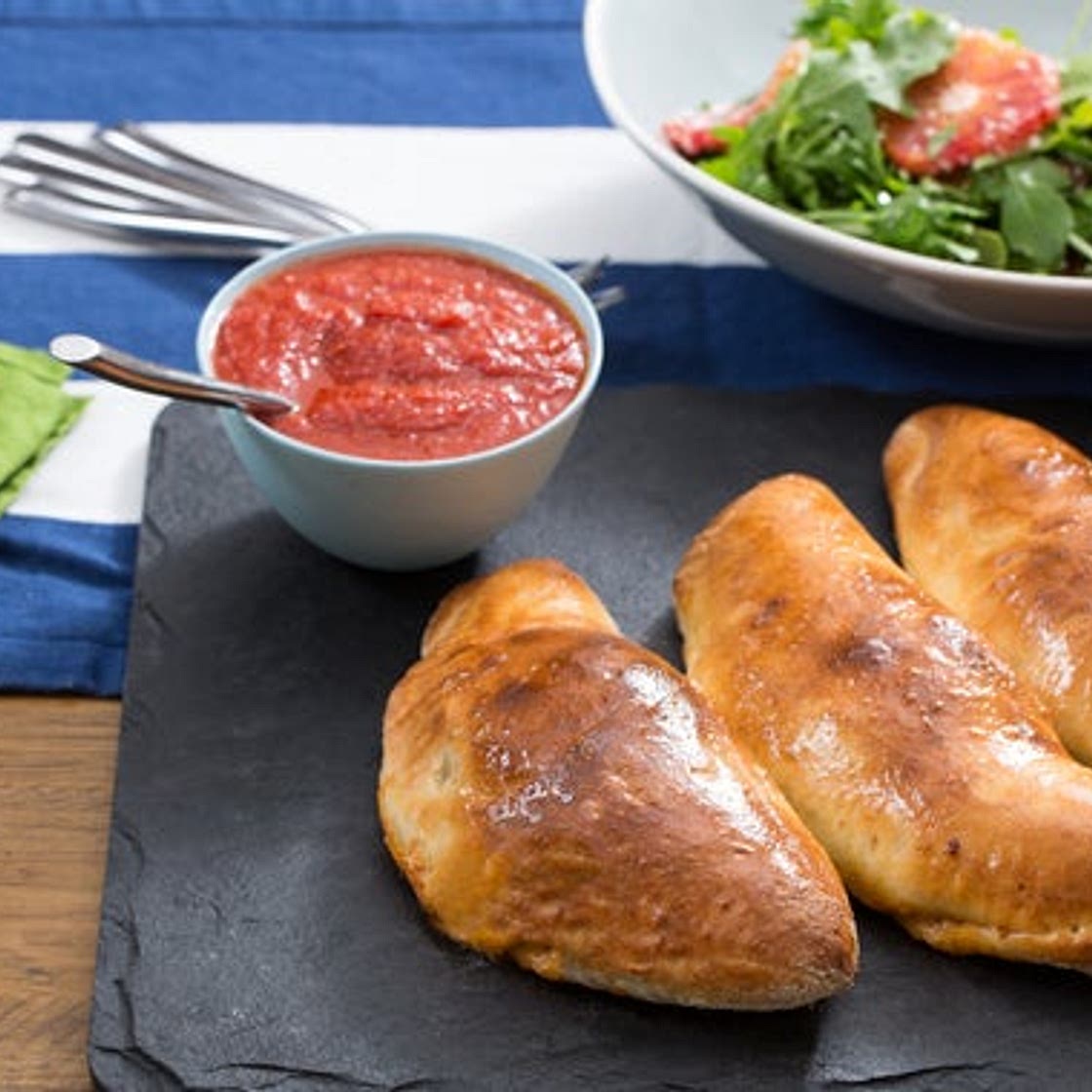 Kale & Ricotta Calzones with Blood Orange & Arugula Salad