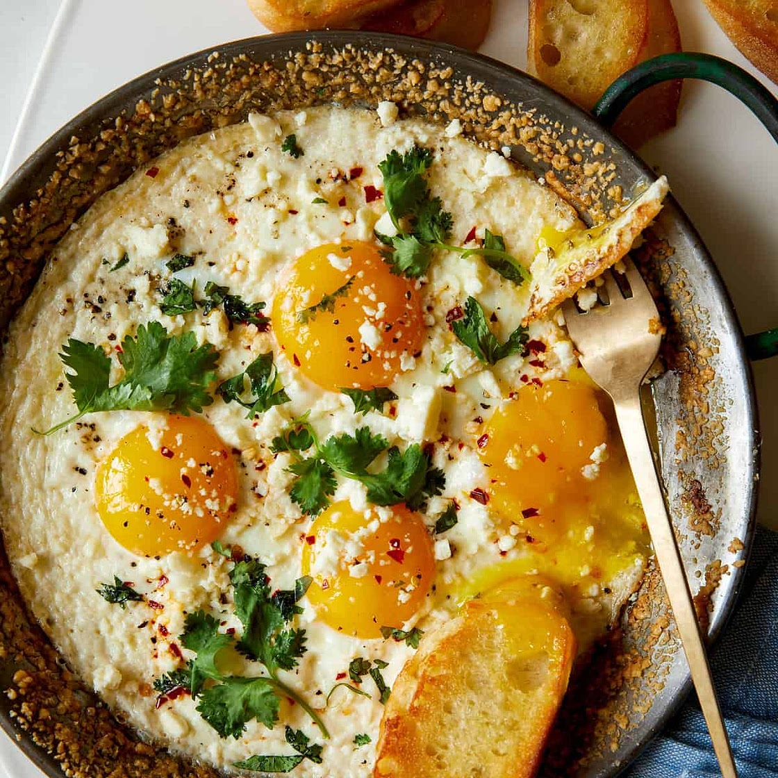 Simple Herb Baked Eggs with Crumbled Cheese