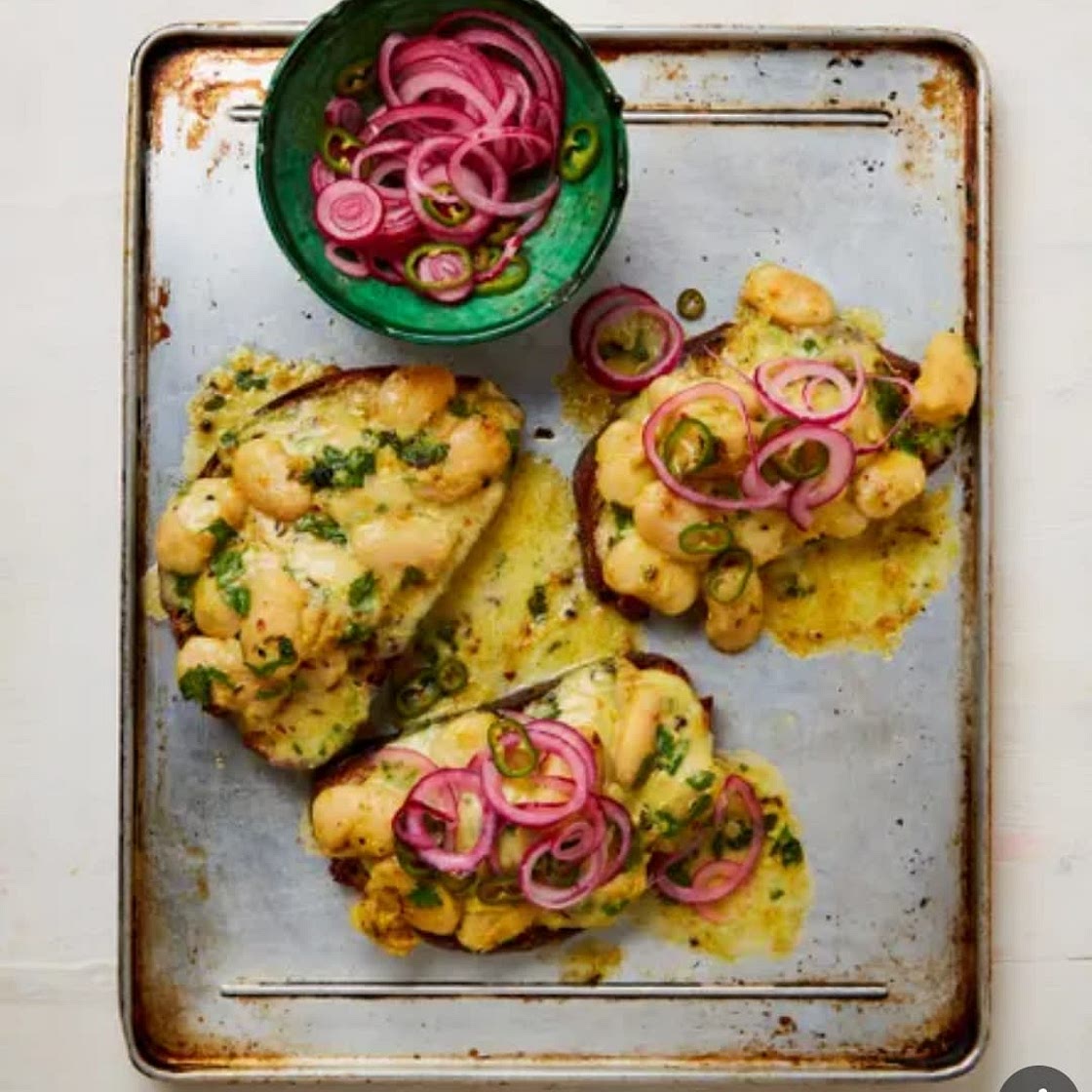 Cheesy curried butter beans on toast
