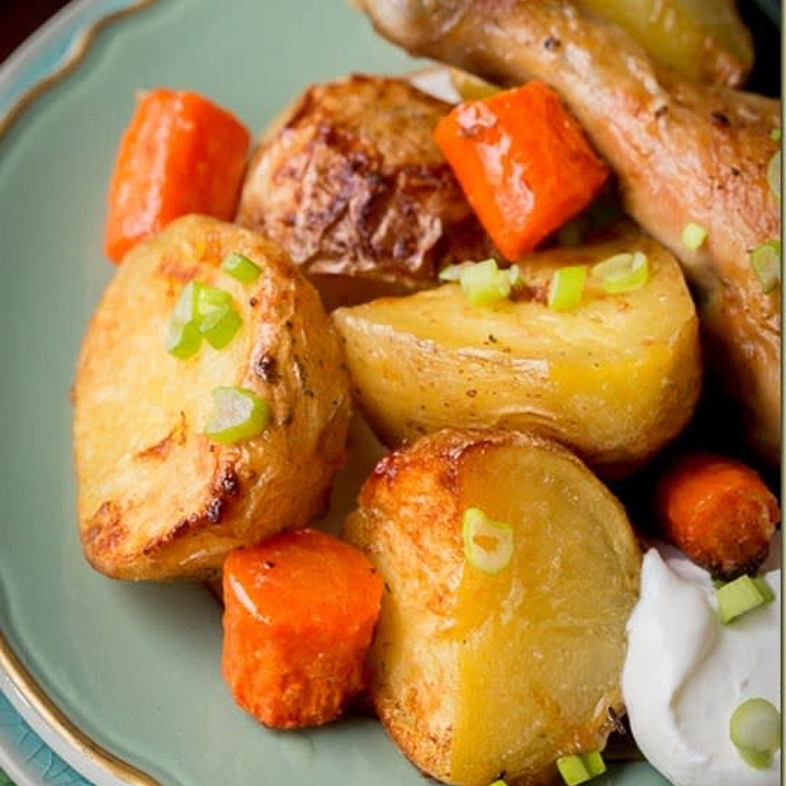 Roasted chicken with potatoes and carrots