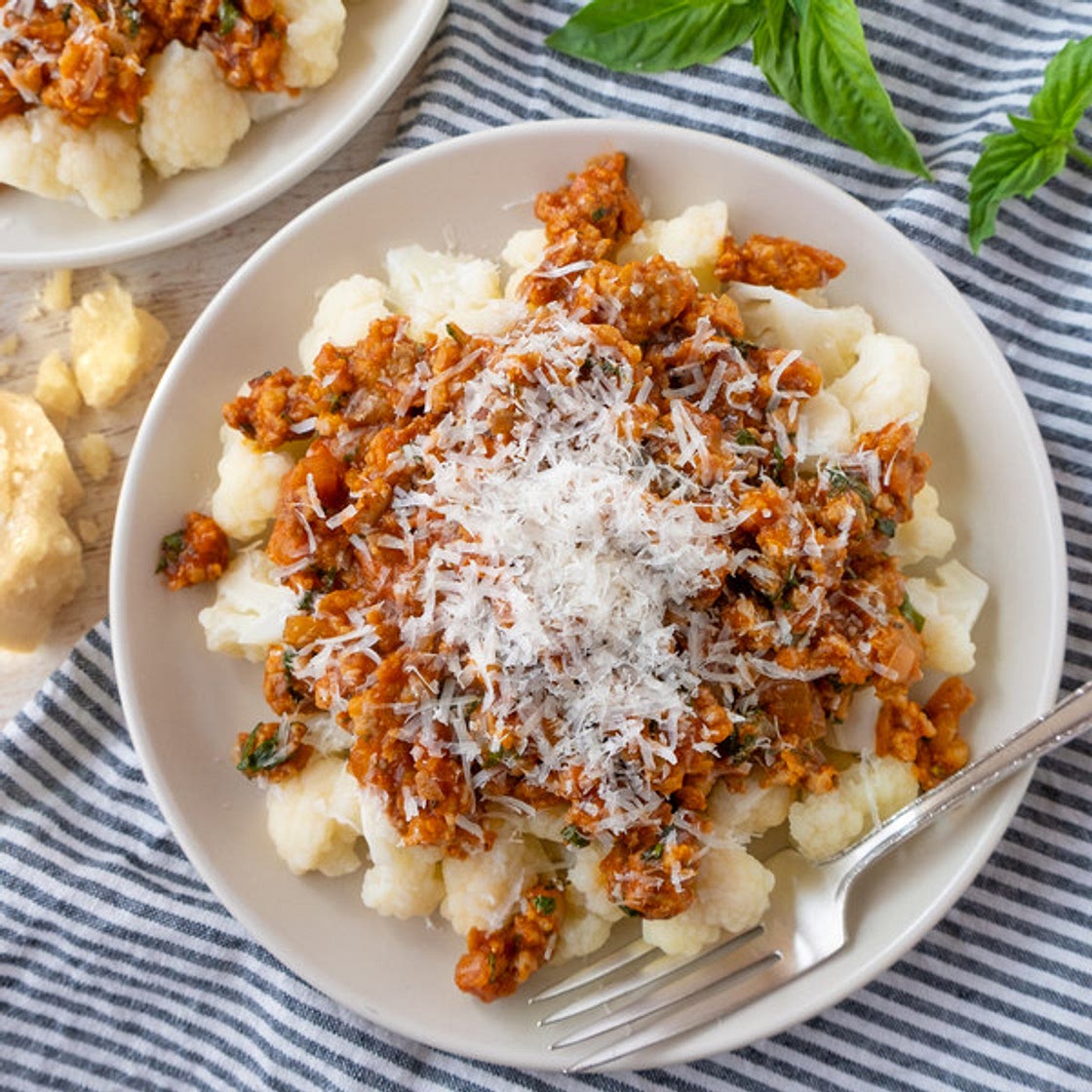 Sausage-Basil Ragú over Tender Cauliflower with Parmesan