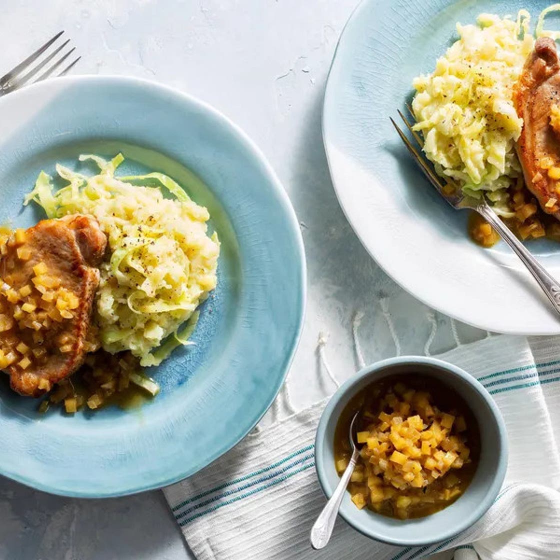 Pork Chops with Apple Pan Sauce, White Sweet Potato, and Cabbage