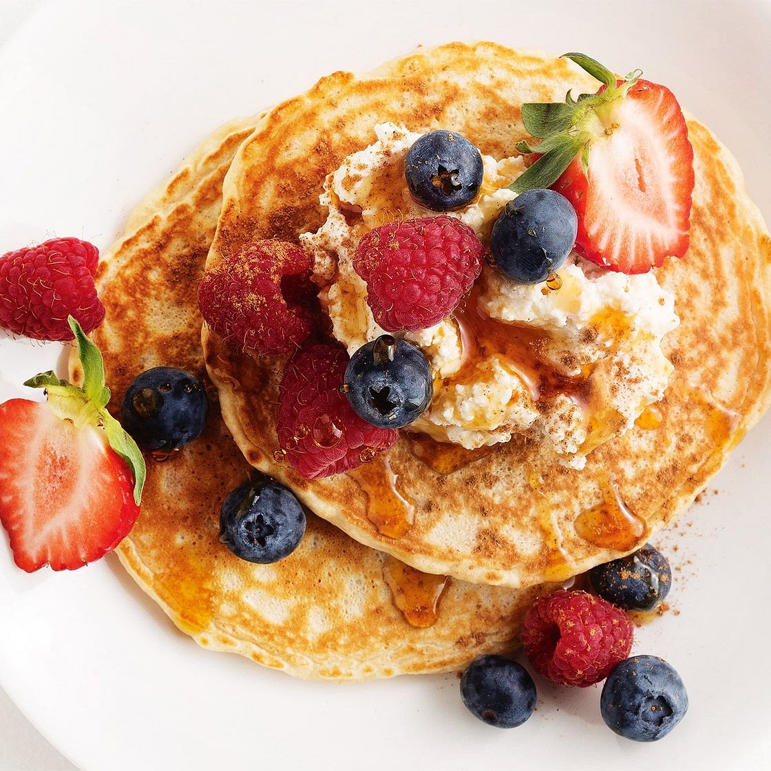 Oat pancakes with vanilla spiced ricotta & berries