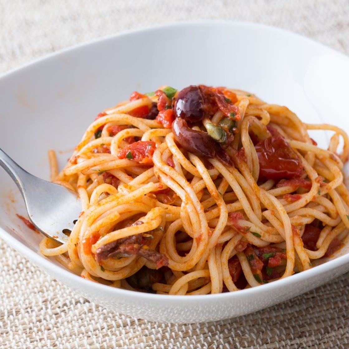 Spaghetti Puttanesca (Tomato, anchovy, olive and garlic spaghetti)