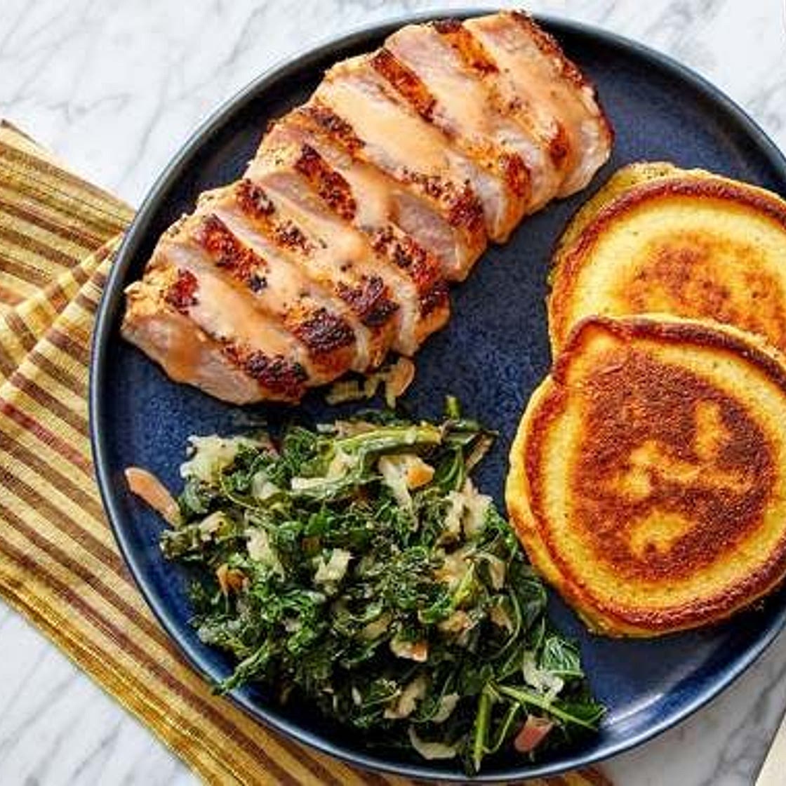 Southern Pork Chops & Crispy Corn Cakes with Braised Apple & Kale