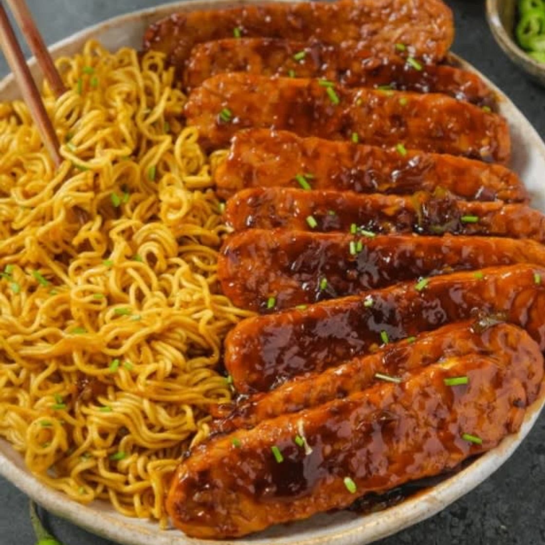 Sweet and Spicy Tempeh with Garlic Curry Noodles - The Foodie Takes Flight