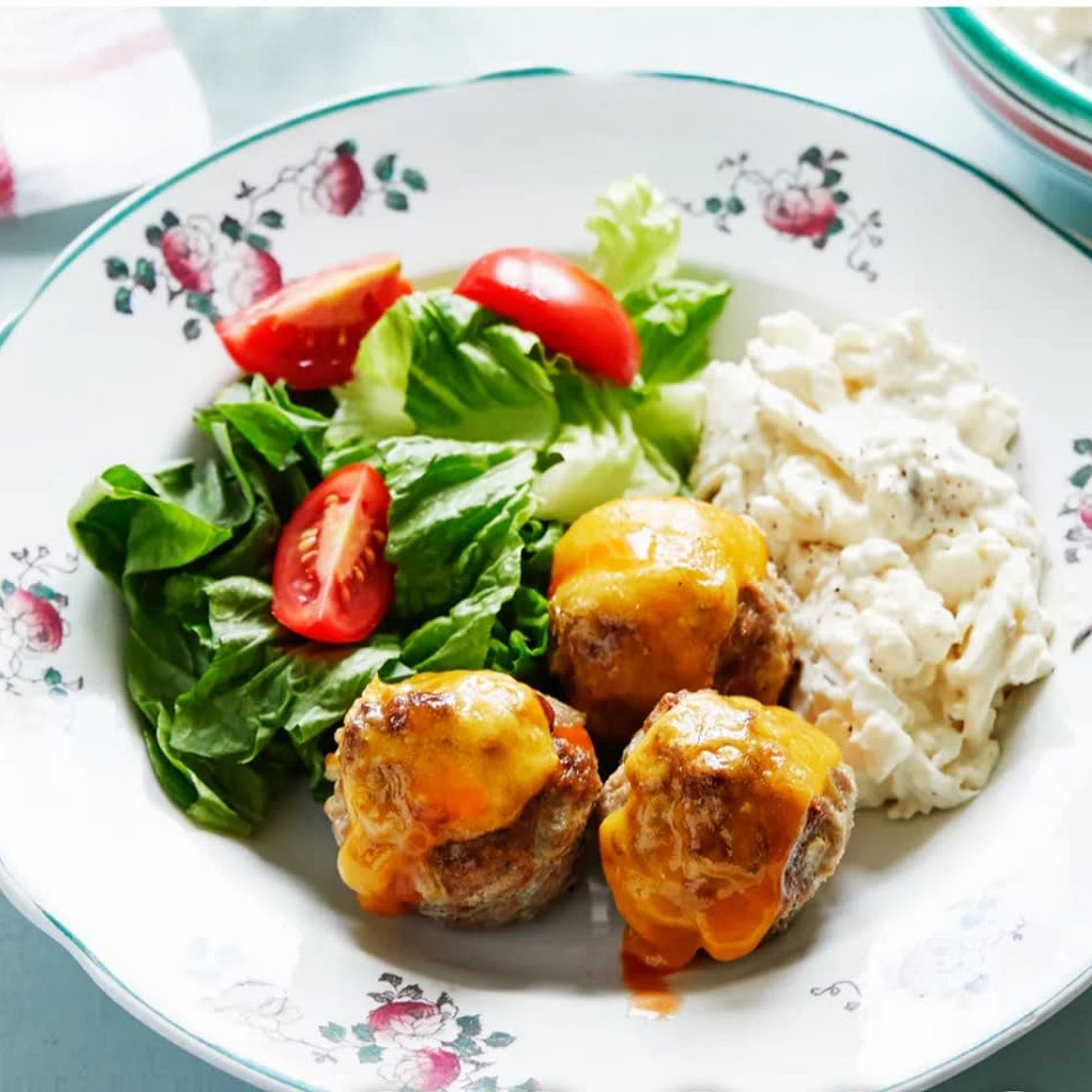 Keto cheesy meatballs with cauliflower slaw