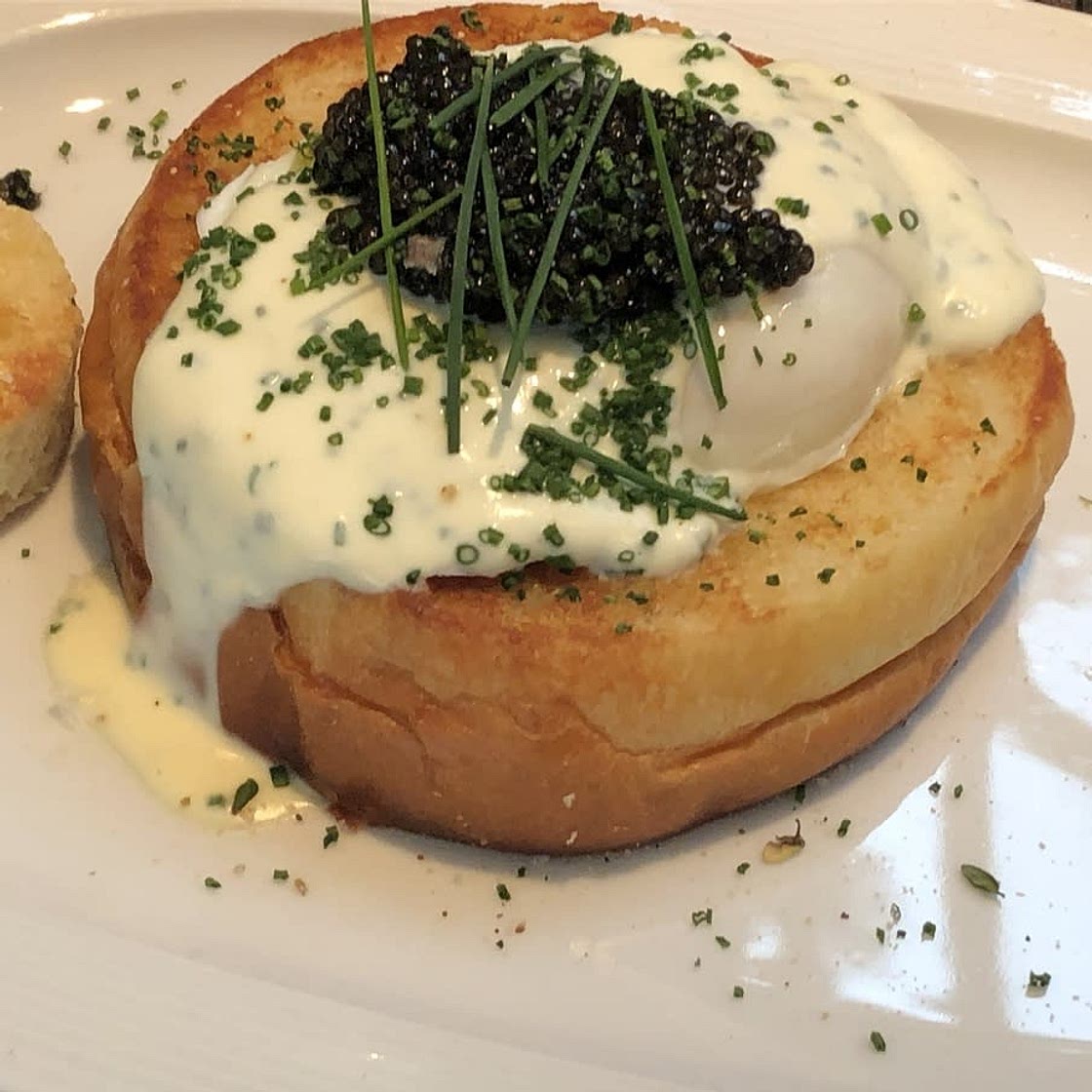 Charlie Palmer's Brioche “toad in a hole” with Black River Caviar