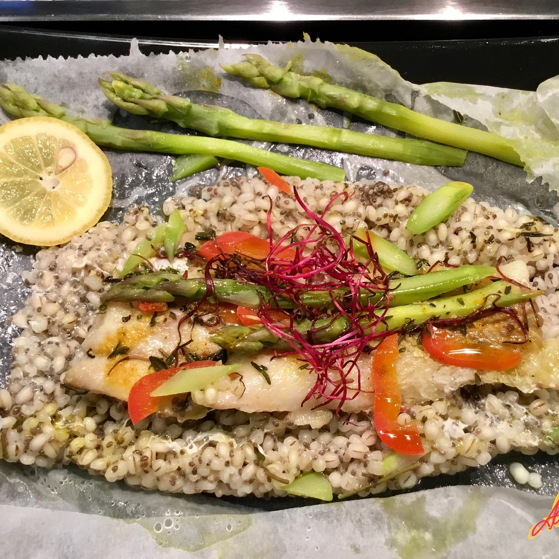 Colin fillet on a bed of barley, chia and asparagus, in foil