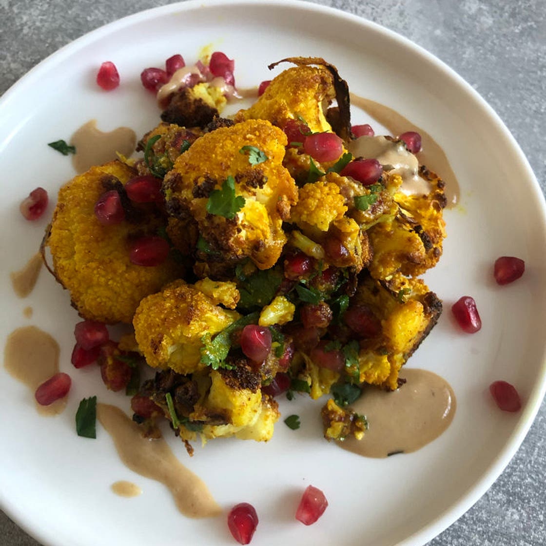 Turmeric roasted cauliflower with pomegranate and tahini