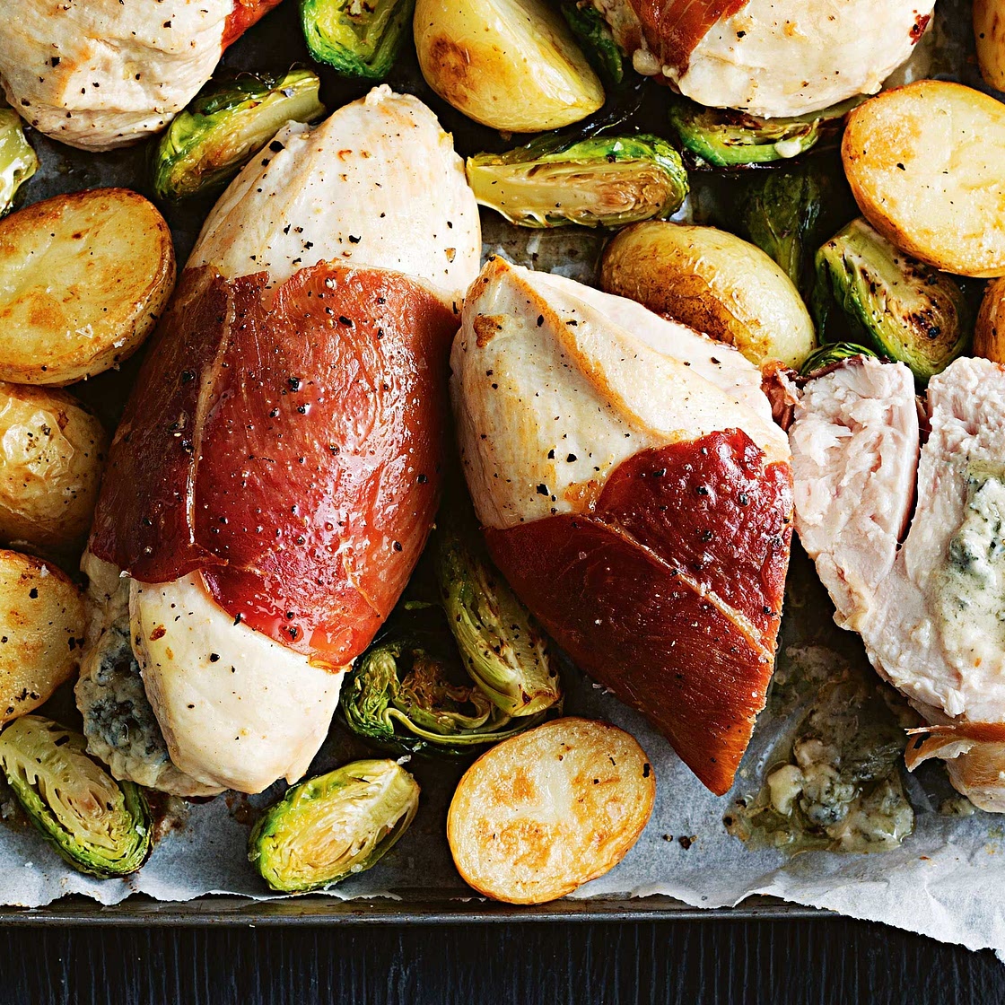Stuffed chicken with roast sprouts and spuds
