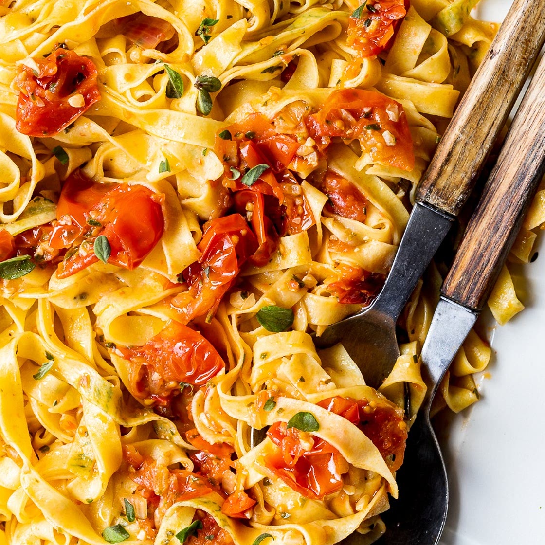 Herb-laminated tagliatelle with cherry tomato sauce