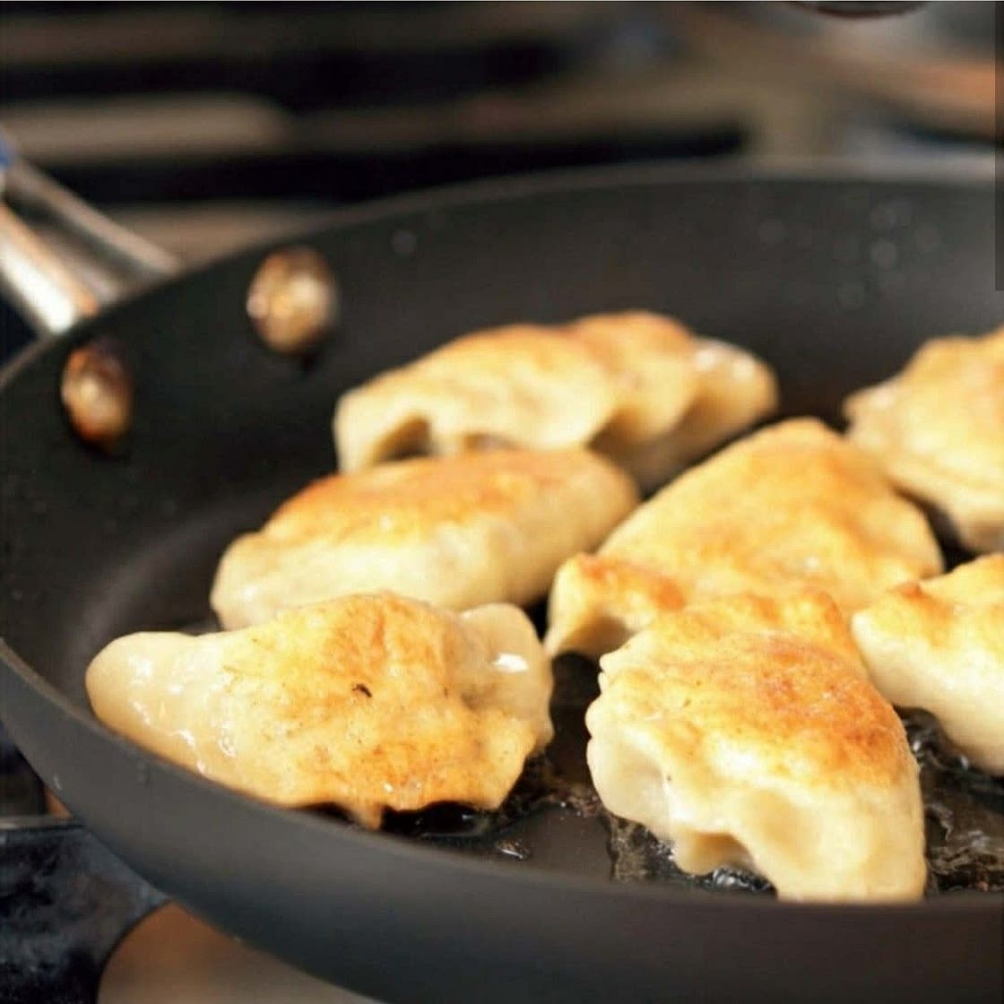 Pierogi with potatoes, cheese, bacon, and pea filling.