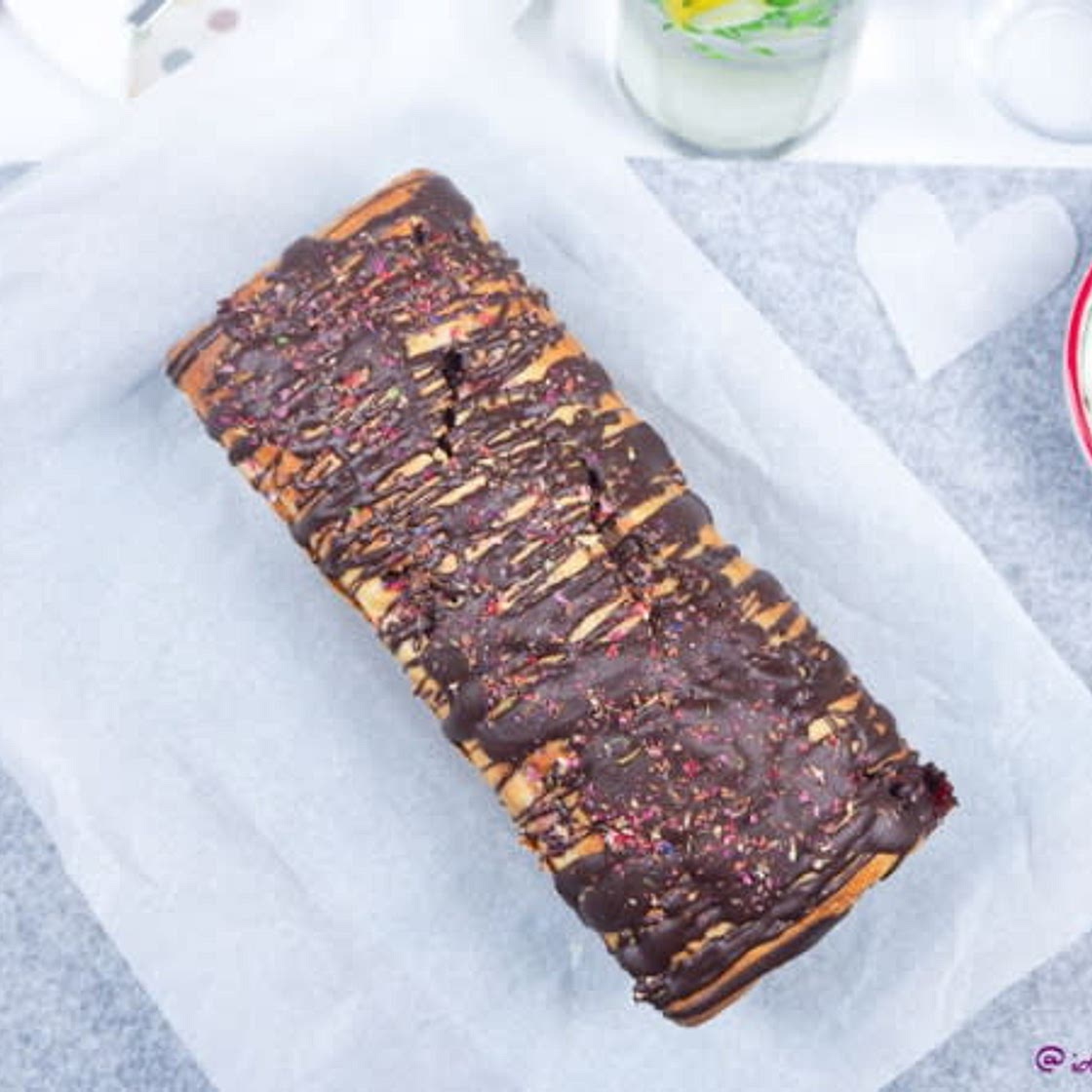 Banana Bread with strawberries and chocolate glaze