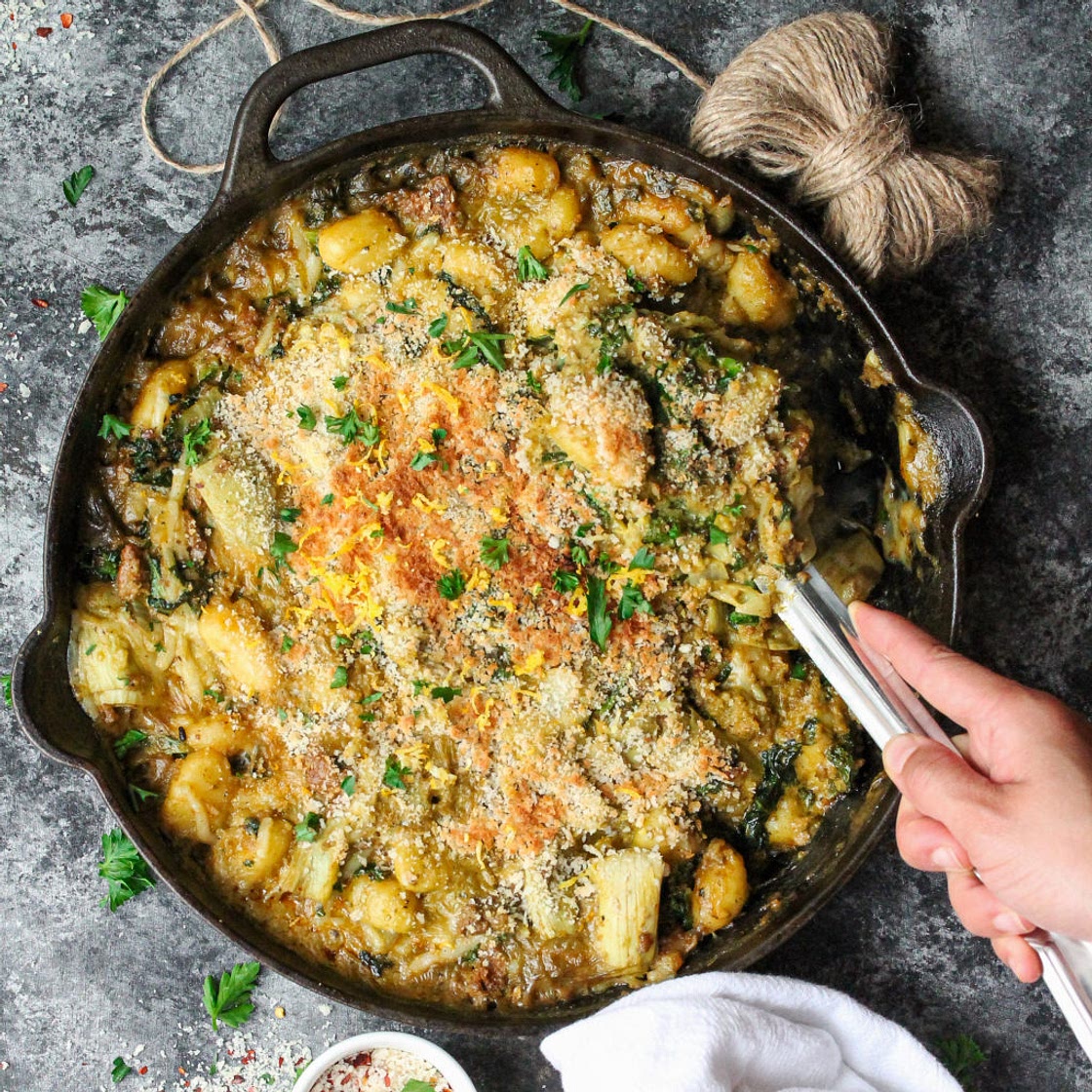 Skillet Baked Vegan Sausage, Kale and Artichoke Gnocchi with Pistachio Pesto
