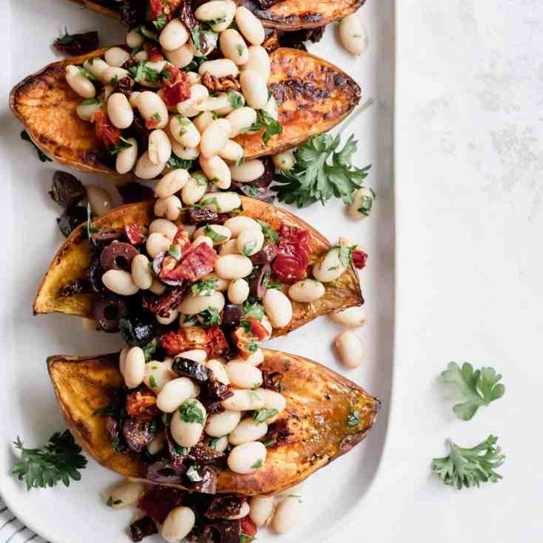 White Bean and Kale Pesto Stuffed Sweet Potatoes