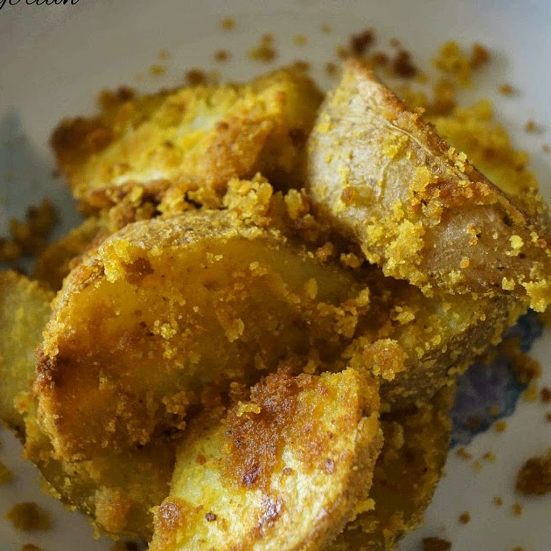COCONUT AND TURMERIC ROAST POTATOES