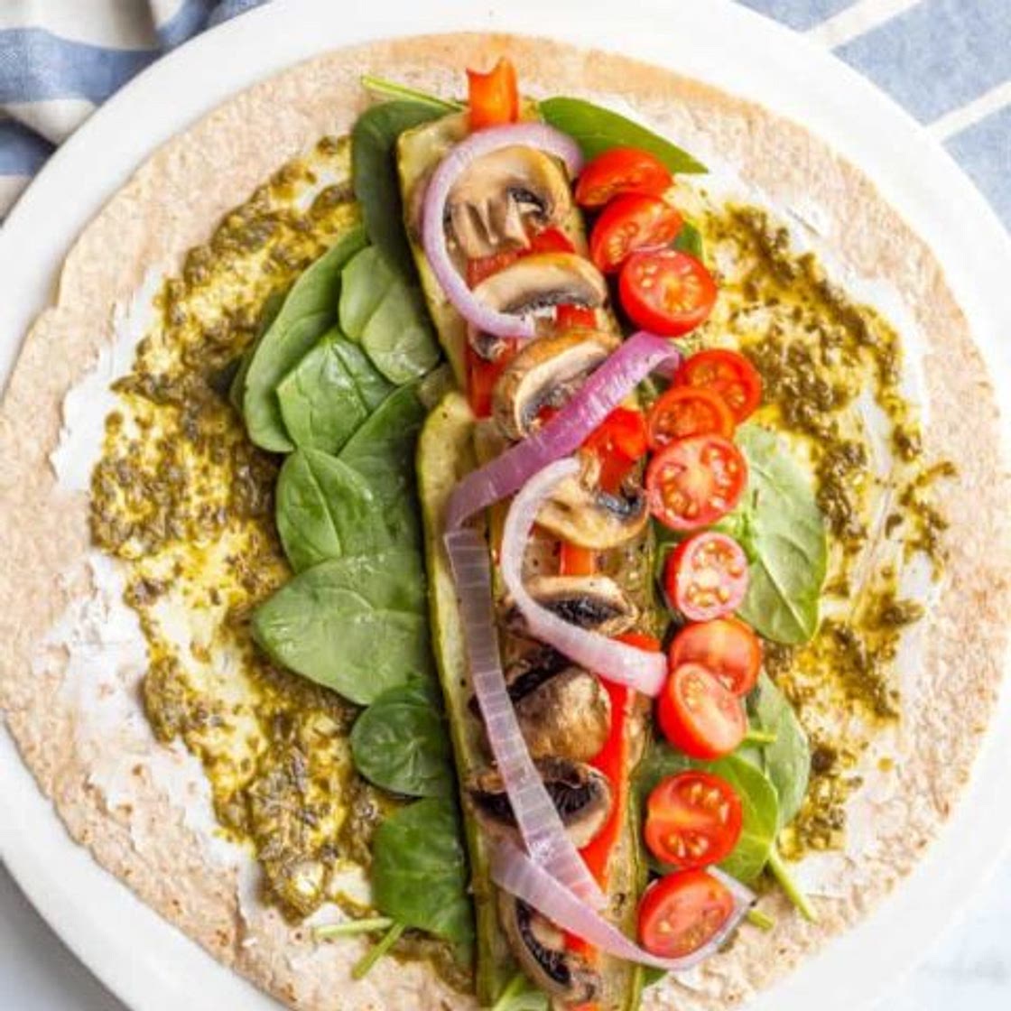 Roasted veggie wrap with pesto and goat cheese