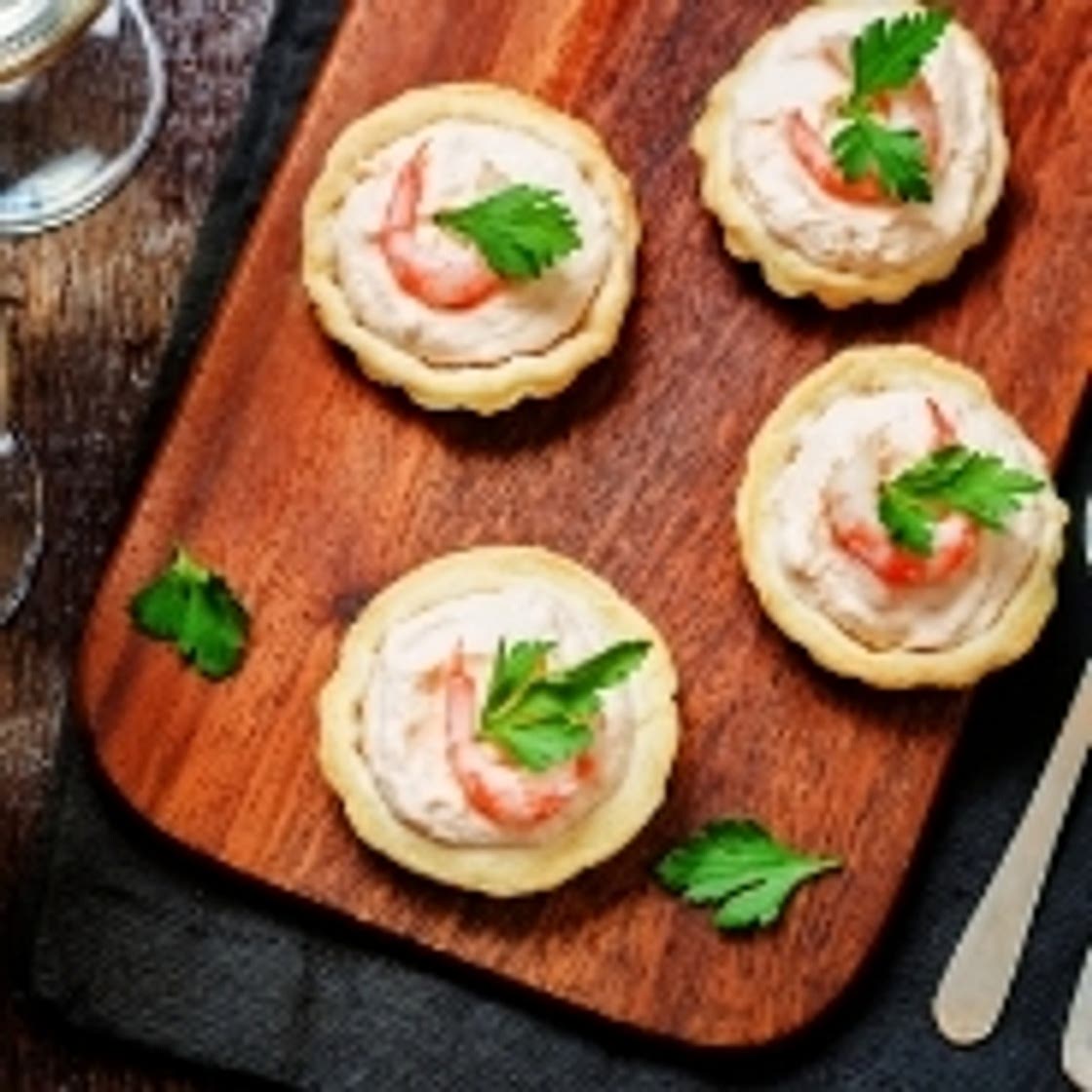 Salmon mousse tartlets and baby eels