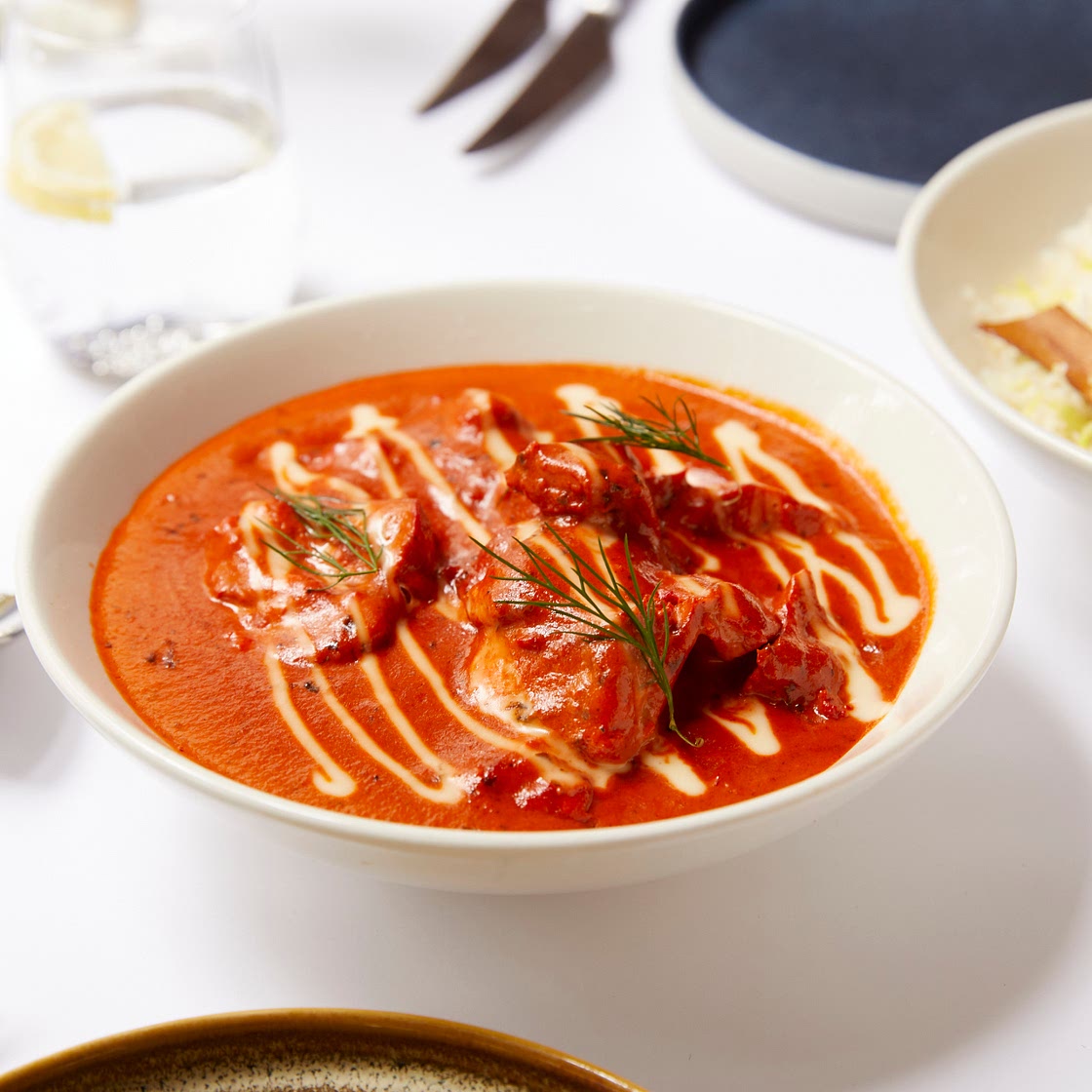 Butter Chicken served with saffron Pulao by Delhi 'O' Delhi