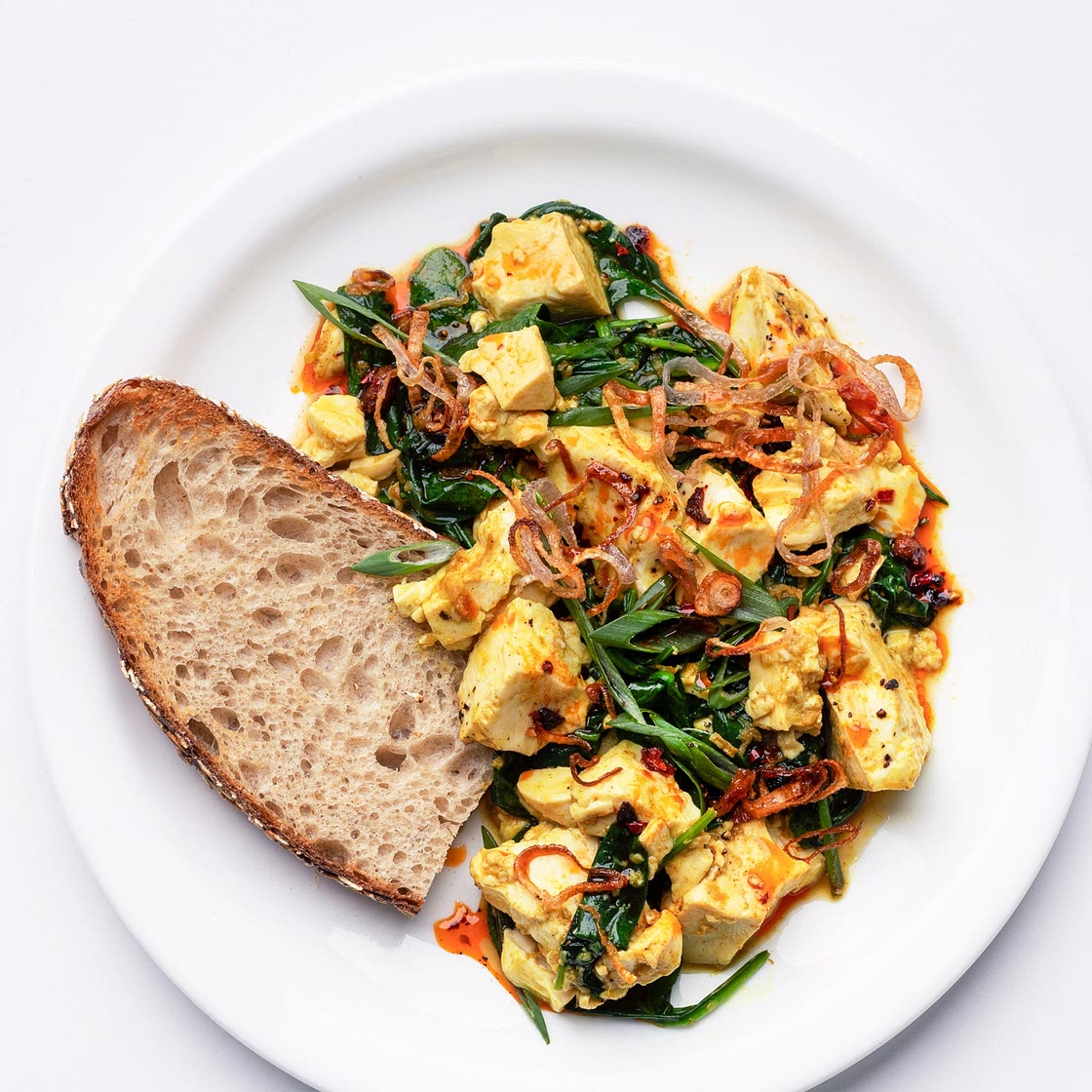 Ginger-Scallion Tofu Scramble With Spinach and Chili Oil