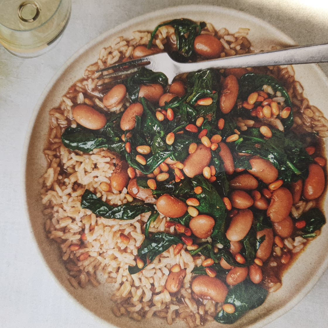 Butter bean and spinach stew with toasted pine nuts