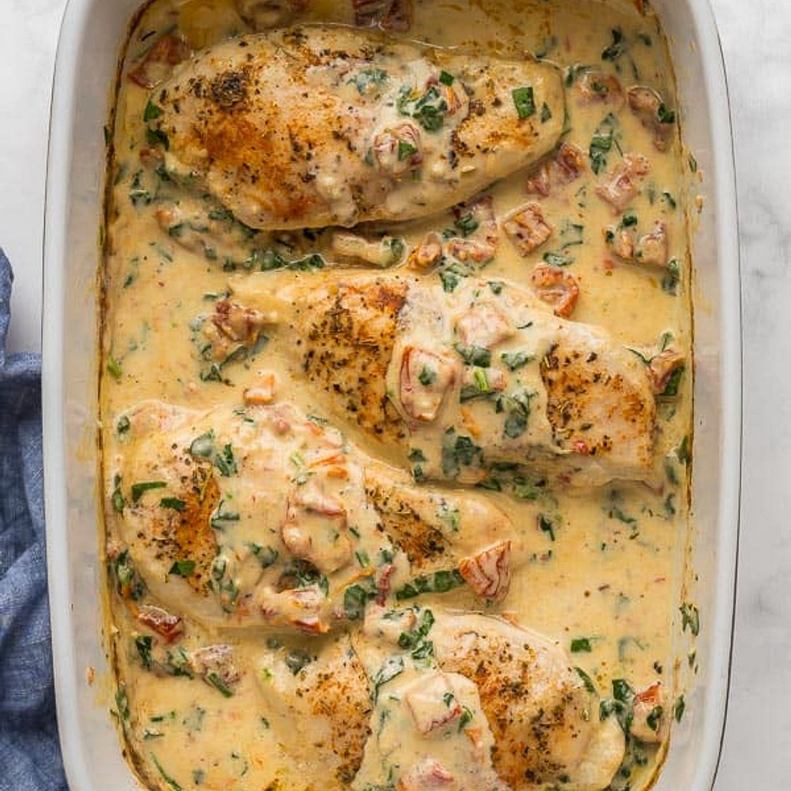 Baked Tuscan ChickenPreheat oven to 425 degrees F. Place chicken breasts on a cutting board and cover with a piece of plastic wr