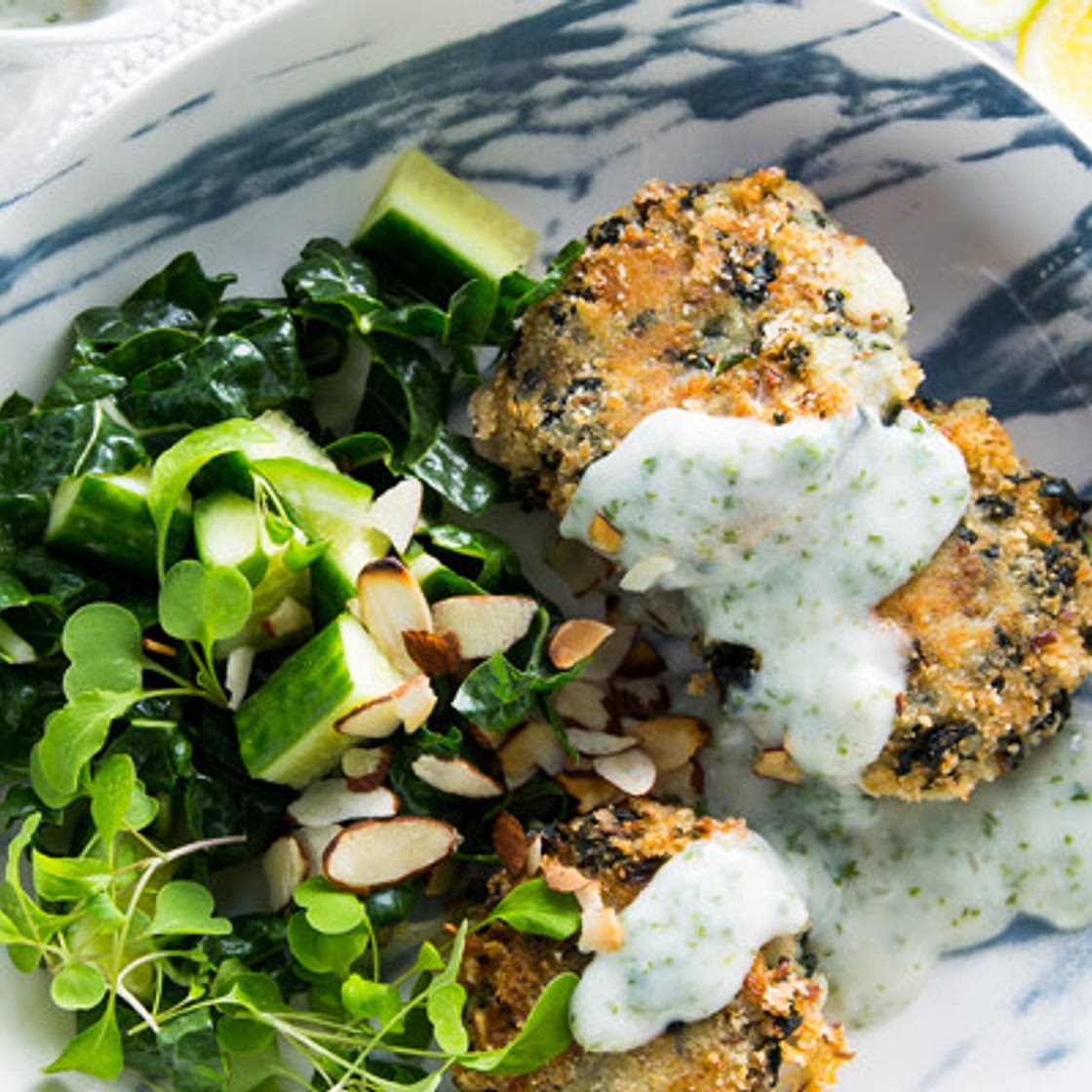 Potato and spinach cakes with almond parsley sauce