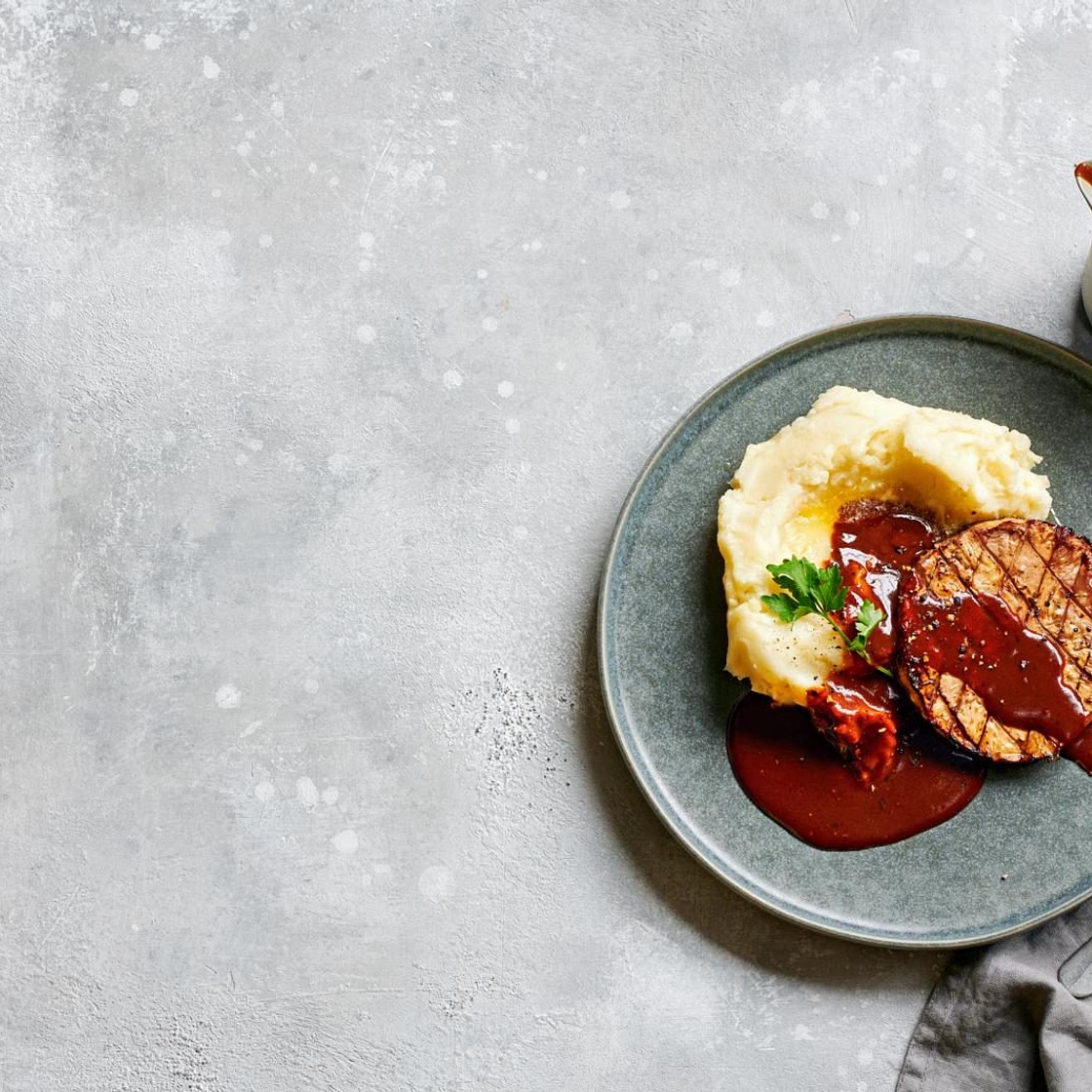 Celeriac steak with mash and gochujang sauce