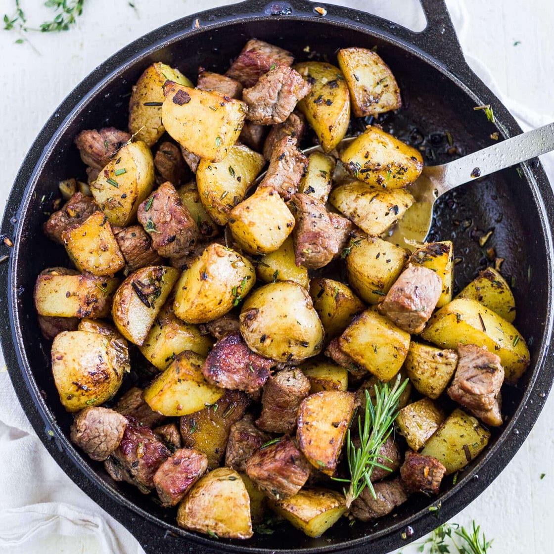 Herby garlic steak bites and potatoes