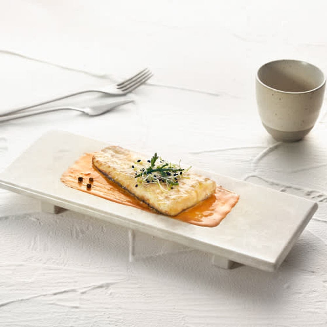 Merluza europea confitada con escabeche de calabaza