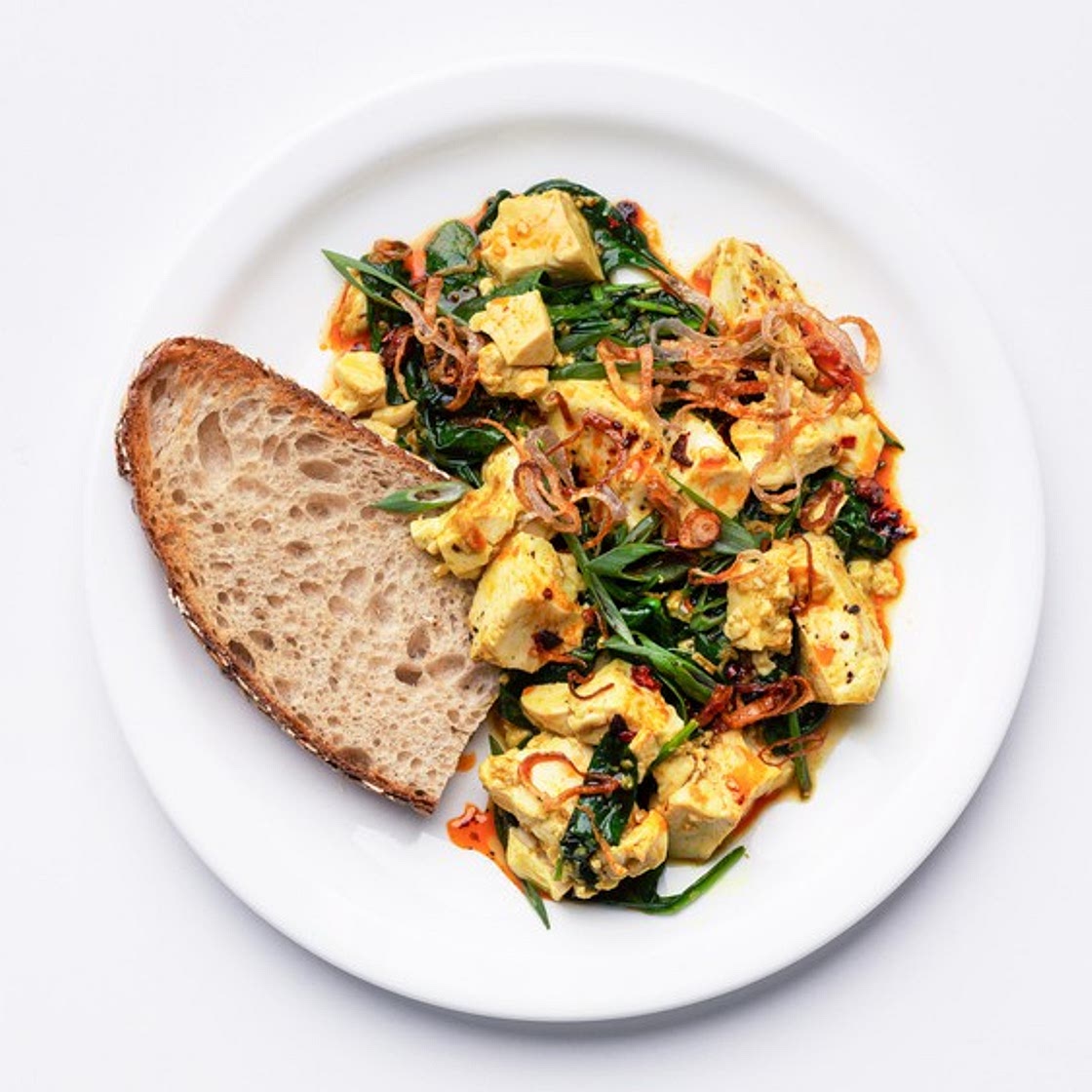 Ginger-Scallion Tofu Scramble With Spinach and Chili Oil — Bon Appétit