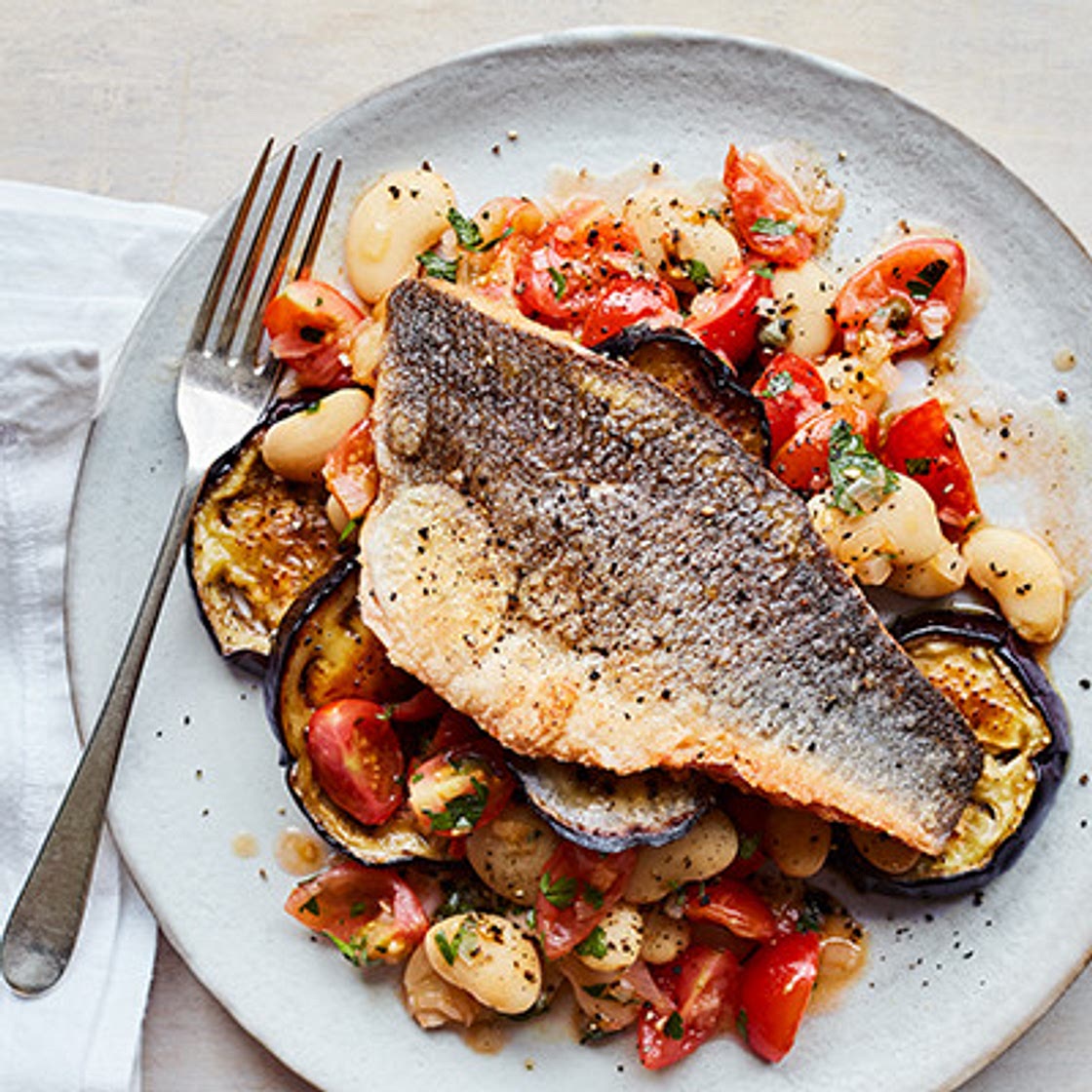 Seabass with tomato and butter bean ragout