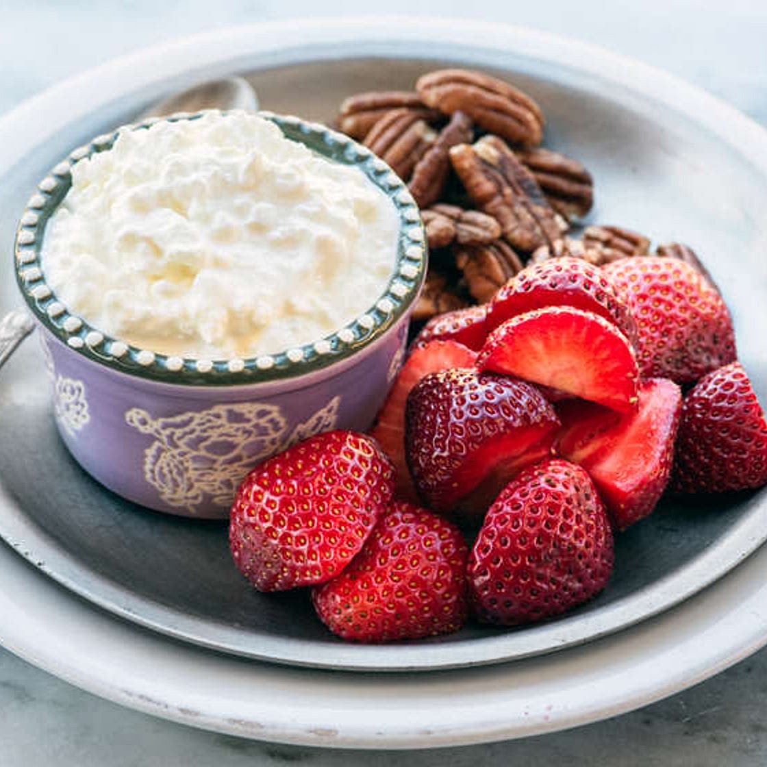Breakfast bento with cottage cheese, berries and nuts