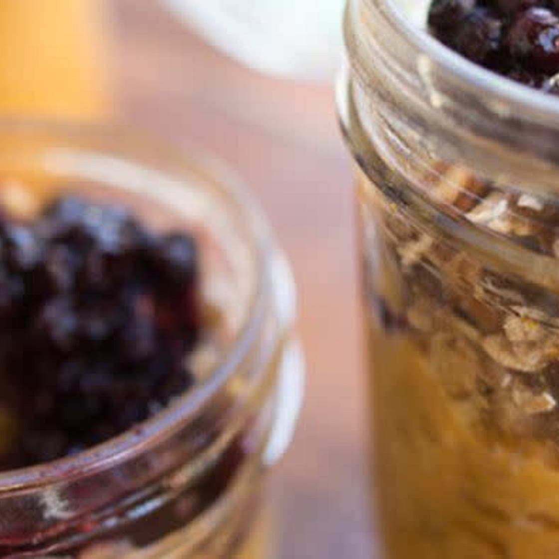 Cinnamon-Spiced Sweet Potato Breakfast topped with Pecan Granola and Blueberry Sauce