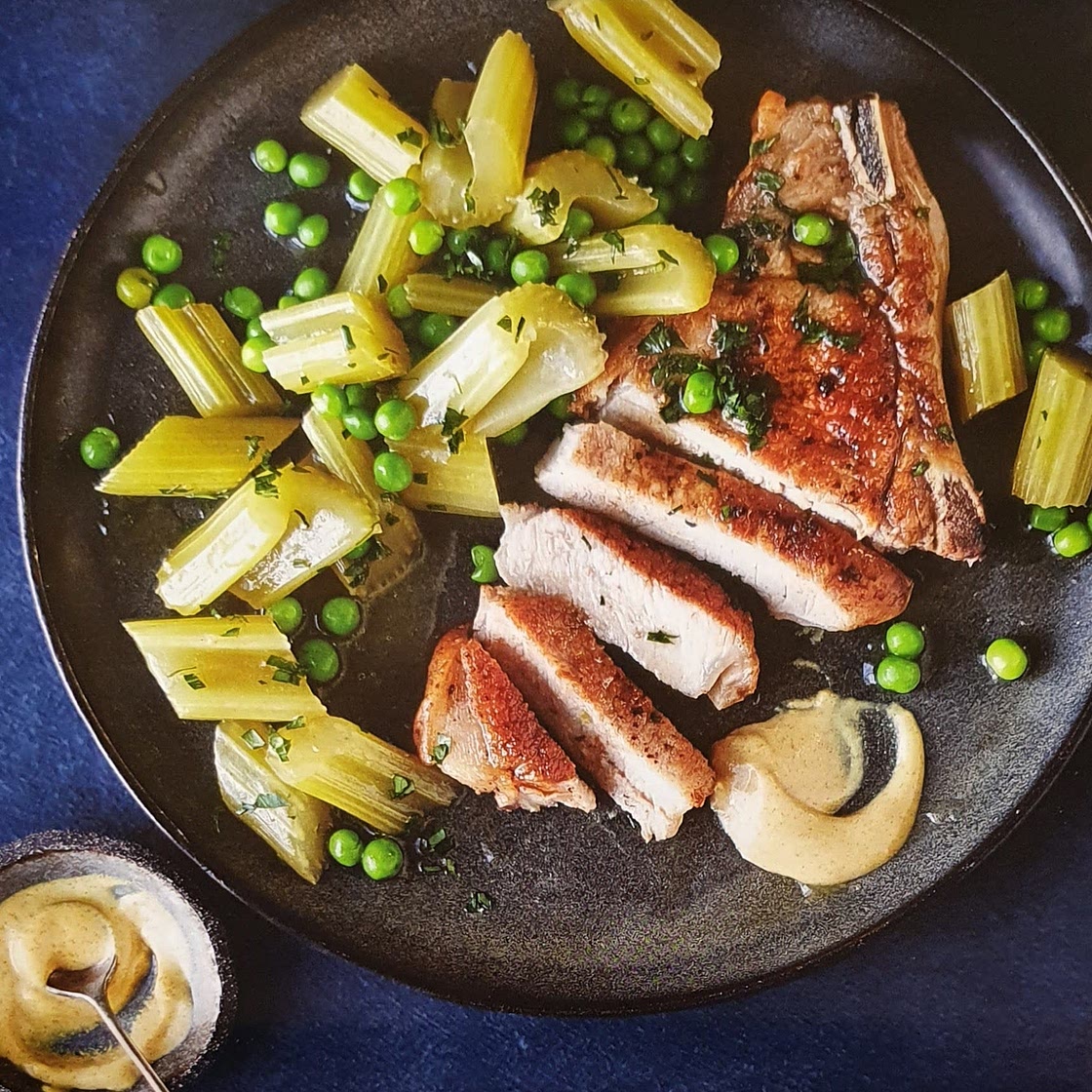 Pork chops with braised celery and peas