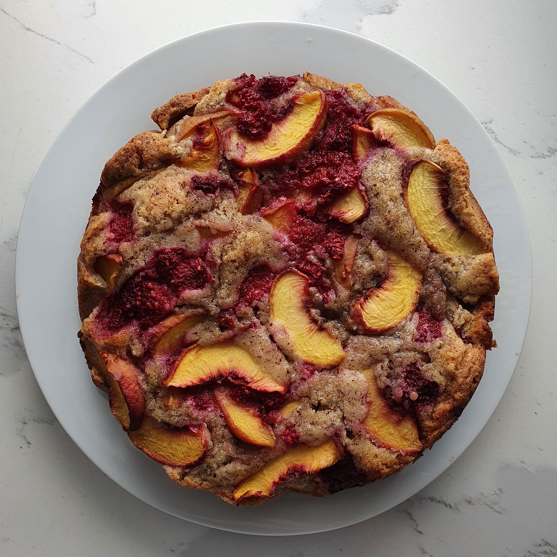 Hazelnut, peach and raspberry cake