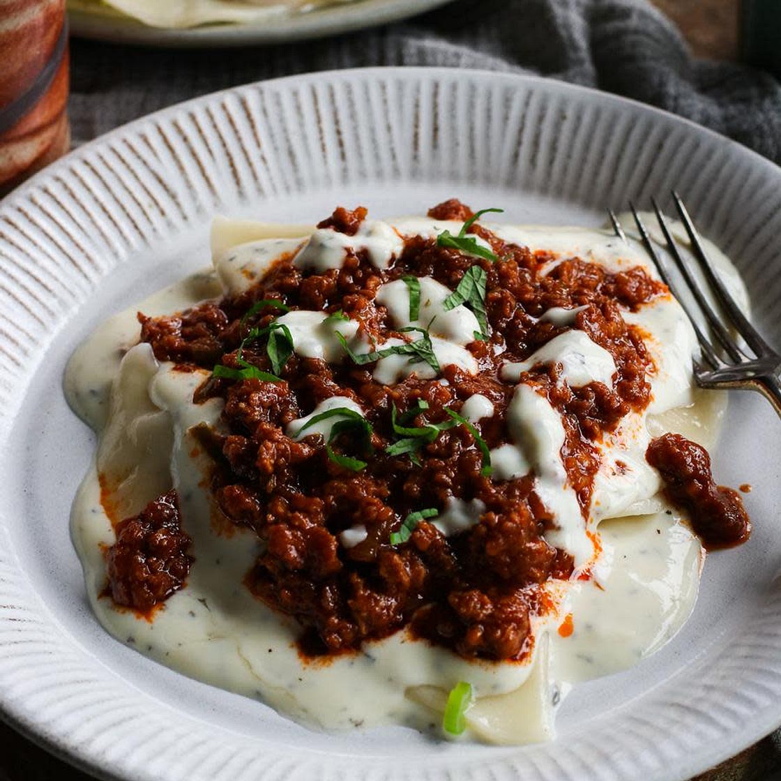 Afghan Gheymeh (tomato 'meat') sauce and yogurt mint sauce for topping Aushak.