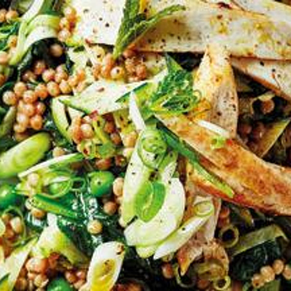 Cumin chicken with giant couscous, courgette, peas and mint
