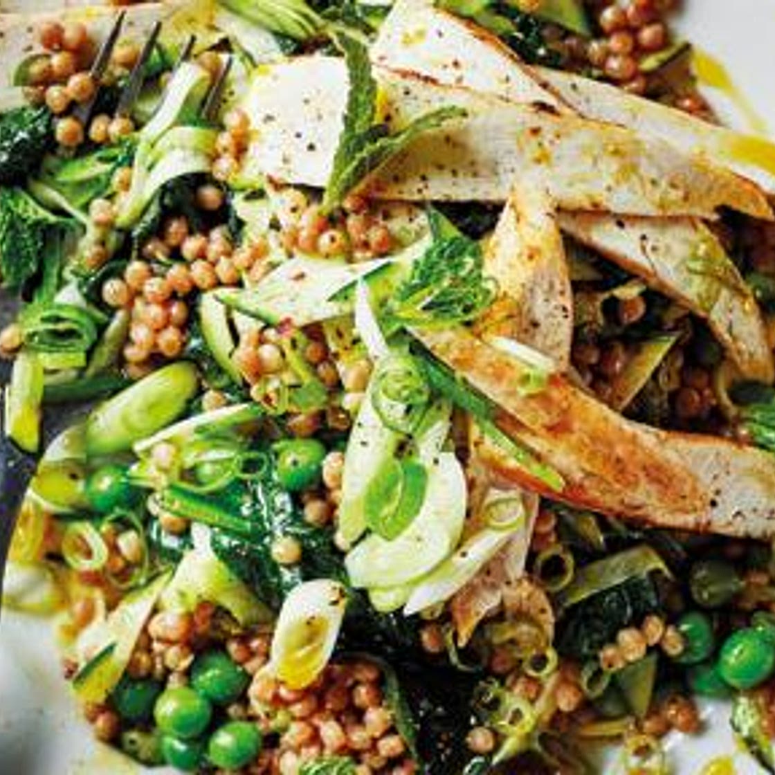 Cumin chicken with giant couscous, courgette, peas and mint