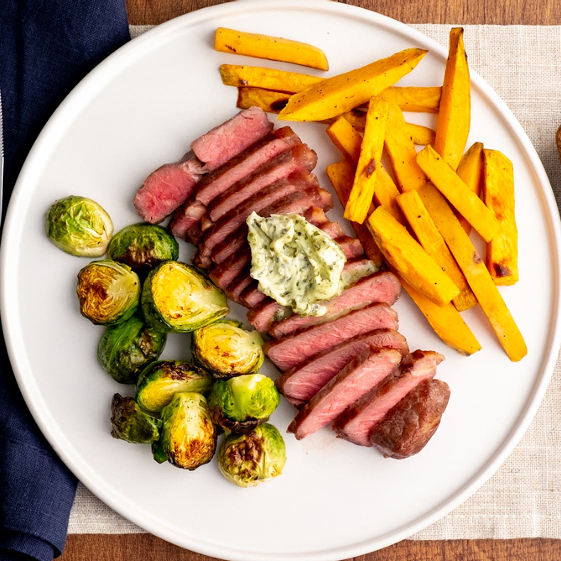 Strip Steak with Roasted Brussels Sprouts and Sweet Potato Fries