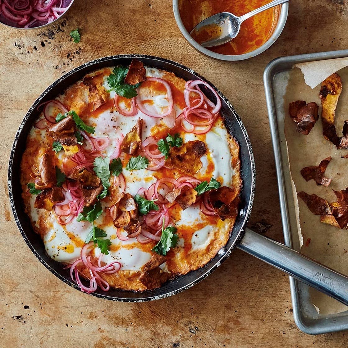 The Ottolenghi Test Kitchen’s Sweet Potato Shakshuka with Sriracha Butter and Pickled Onions