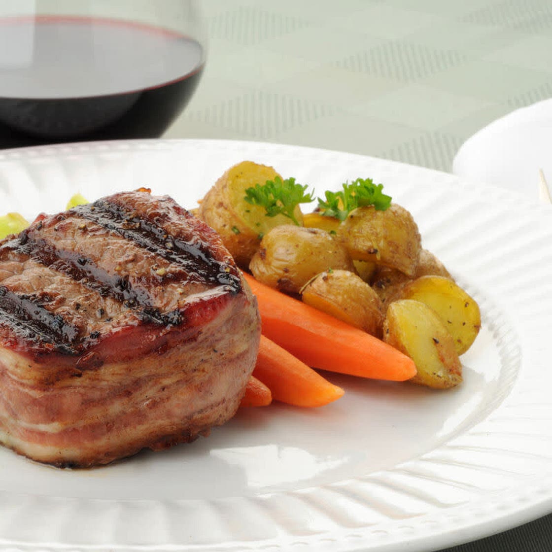 Bacon wrapped filets with baby potatoes