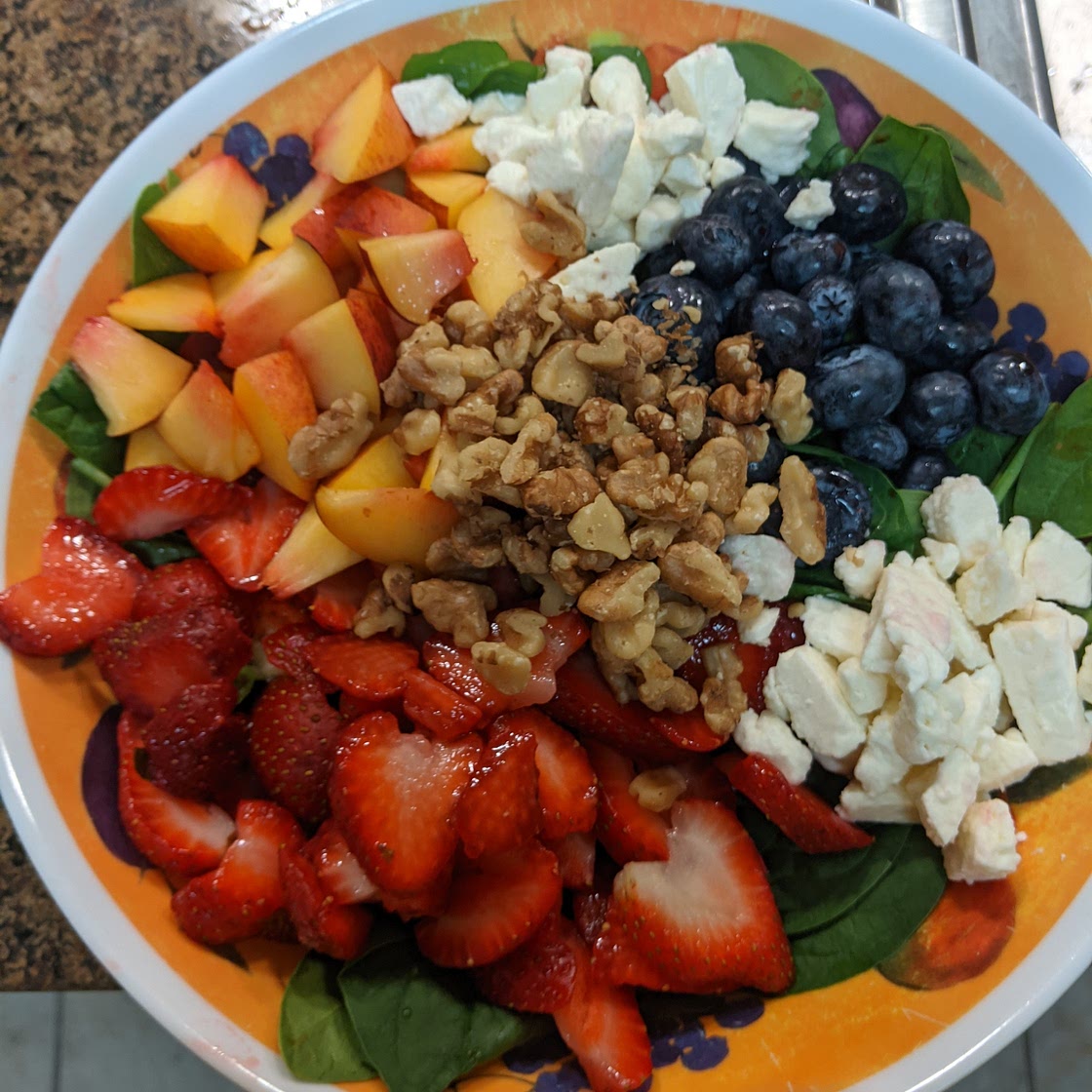 Summer spinach salad with fresh fruit & walnuts
