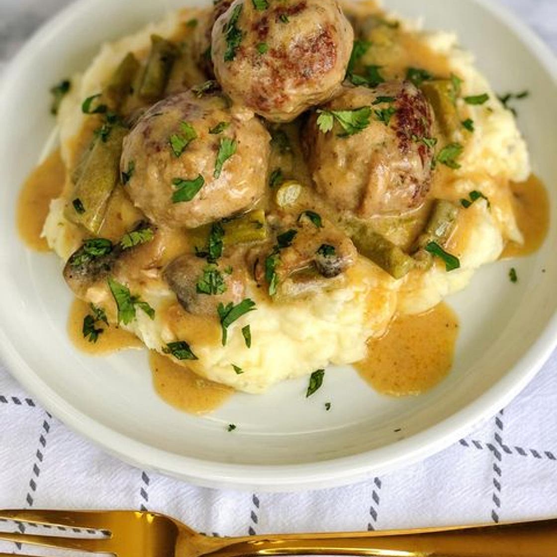 Turkey meatballs in a creamy mushroom and asparagus sauce