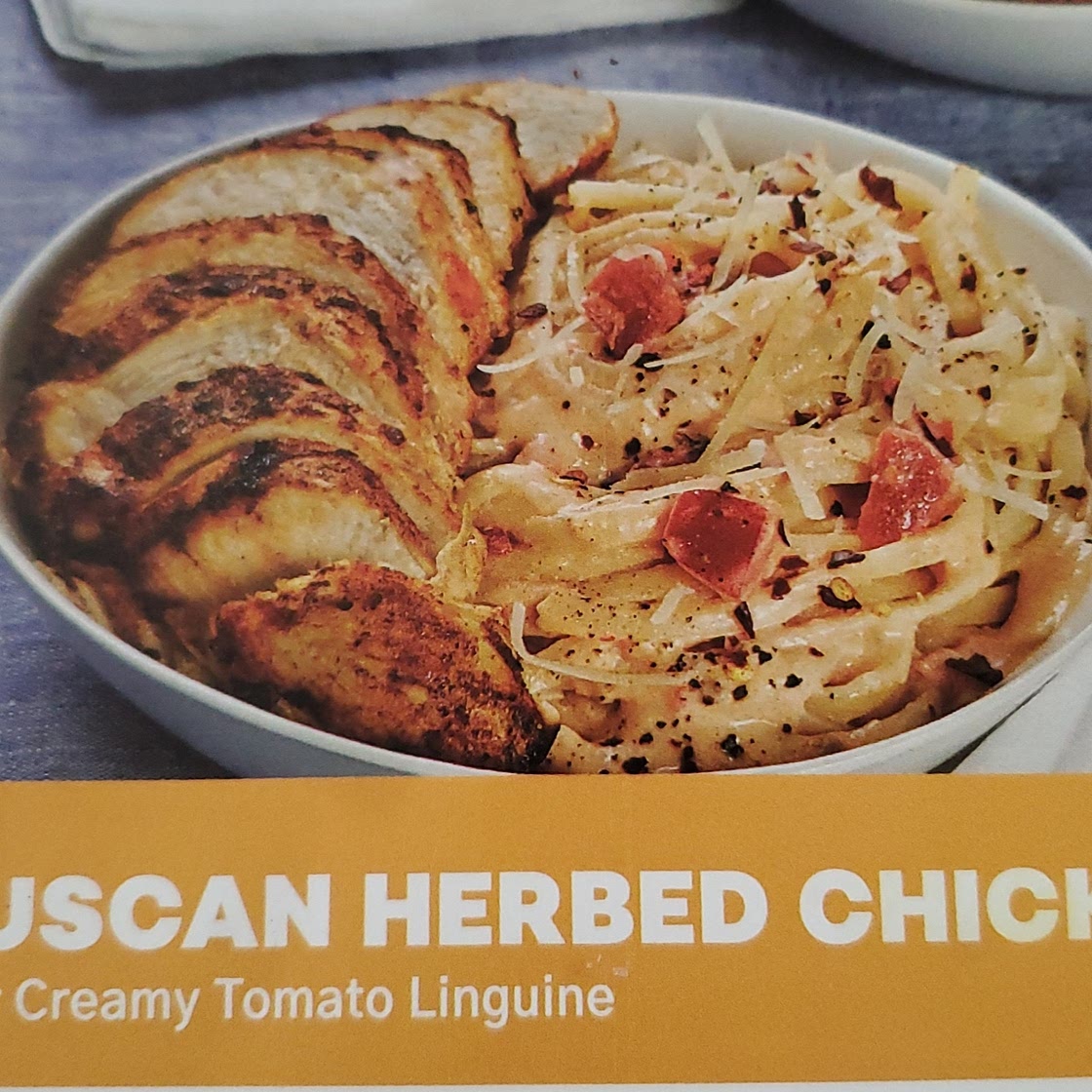 Tuscan herbed chicken over creamy tomato linguine
