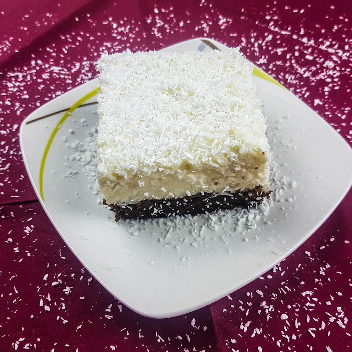 Coconut cake recipe

This amazing coconut cream poured over a fine cocoa biscuit will brighten your day. Try this cake today.