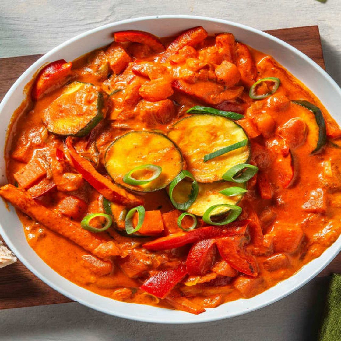 Tikka-Masala-Curry mit Süßkartoffel Bei diesem Rezept wird 50% weniger CO2e durch Zutaten & Transport verursacht als bei einem durchschnittlichen HelloFresh Rezept